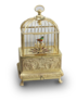 Vintage miniature gilt brass singing bird in cage, by Eschle