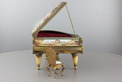 A large vintage Viennese enamel and gilt metal musical grand piano with chair