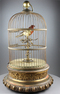 Large antique single singing bird-in-cage, by Phallibois