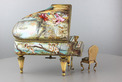 A large vintage Viennese enamel and gilt metal musical grand piano with chair