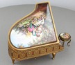 A fine Viennese gilt metal and signed pictorial enamel piano-form musical box and stool