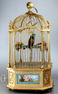 A stunning and very fine gilt bronze and Sevres plaque single singing bird-in-cage, by Bontems