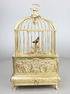 Vintage miniature gilt brass singing bird in cage, by Eschle