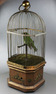 Antique large single singing bird in cage, by Bontems