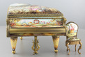 A large vintage Viennese enamel and gilt metal musical grand piano with chair