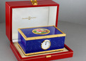 Lapis-lazuli enamelled and gilt musical timepiece alarm-actuated singing bird box, by Reuge