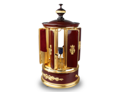 A contemporary maroon lacquer and metal gilt singing bird cigar dispenser carousel, by Reuge