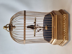 Vintage single singing bird in cage, by Karl Griesbaum