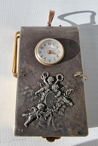 Aide memoire with watch, photographic portrait and notebook