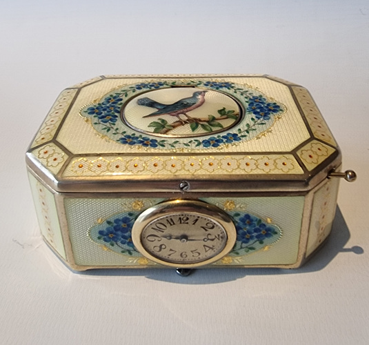 A very fine silver gilt and Imperial Yellow guilloche enamel singing bird box with timepiece, by C. A. Marguerat