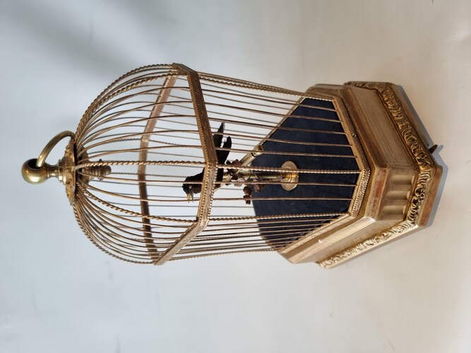 Vintage single singing bird in cage, by Karl Griesbaum