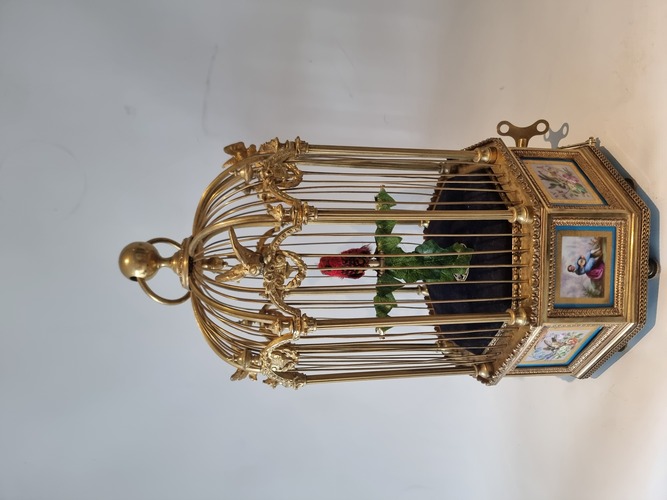A stunning and very fine Hexagonal shaped, gilt bronze and Sevres plaque single singing bird-in-cage, by Bontems