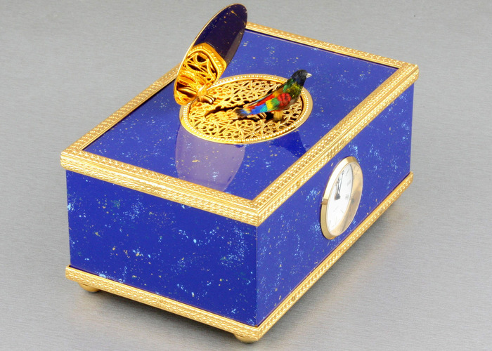 Lapis-lazuli enamelled and gilt musical timepiece alarm-actuated singing bird box, by Reuge