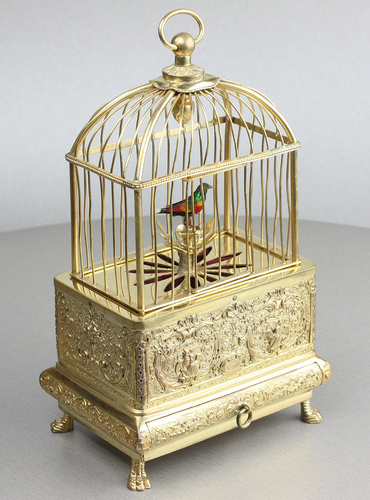 Vintage miniature gilt brass singing bird in cage, by Eschle