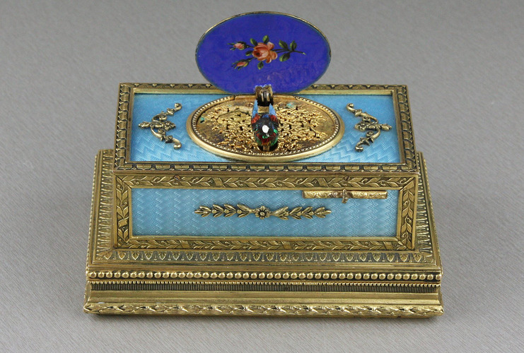 Powder blue guilloche and pictorial enamel singing bird box casket, by C. H. Marguerat