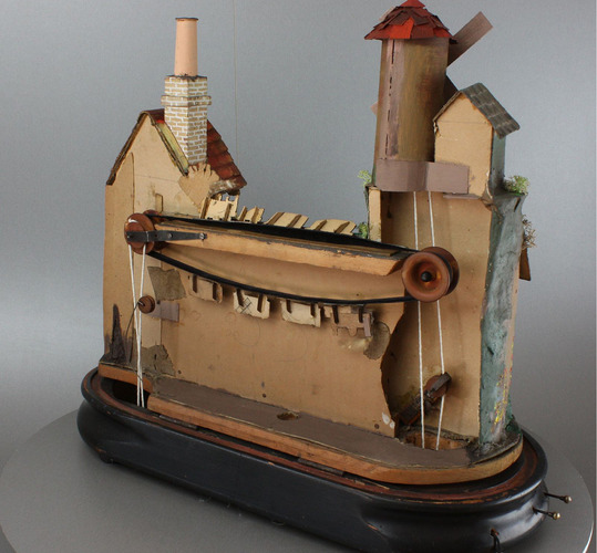A complex windmill, watermill, dual locomotive and rocking ship musical automaton
