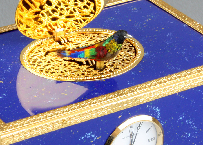 Lapis-lazuli enamelled and gilt musical timepiece alarm-actuated singing bird box, by Reuge