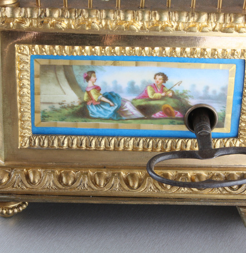 A stunning and very fine gilt bronze and Sevres plaque single singing bird-in-cage, by Bontems