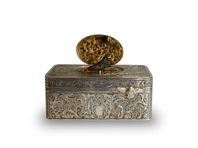 Engraved silver-gilt and painted ivorine pictorial study singing bird box,  Early-period Karl Griesbaum