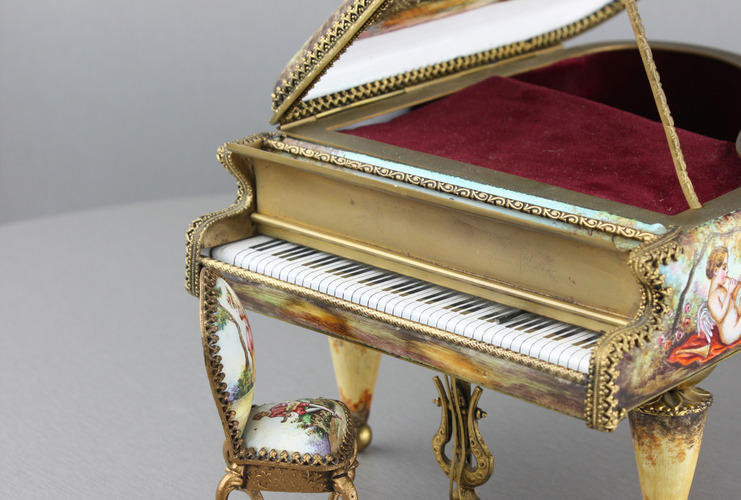 A large vintage Viennese enamel and gilt metal musical grand piano with chair