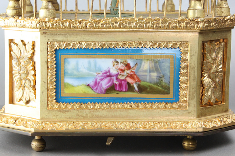 A stunning and very fine gilt bronze and Sevres plaque single singing bird-in-cage, by Bontems