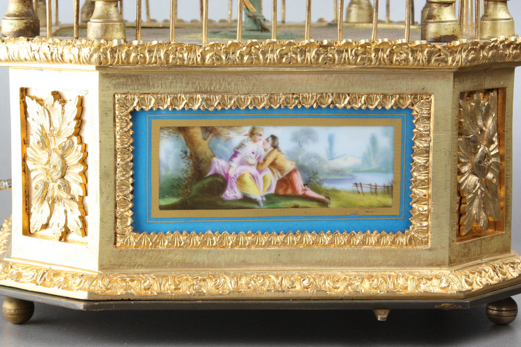A stunning and very fine gilt bronze and Sevres plaque single singing bird-in-cage, by Bontems