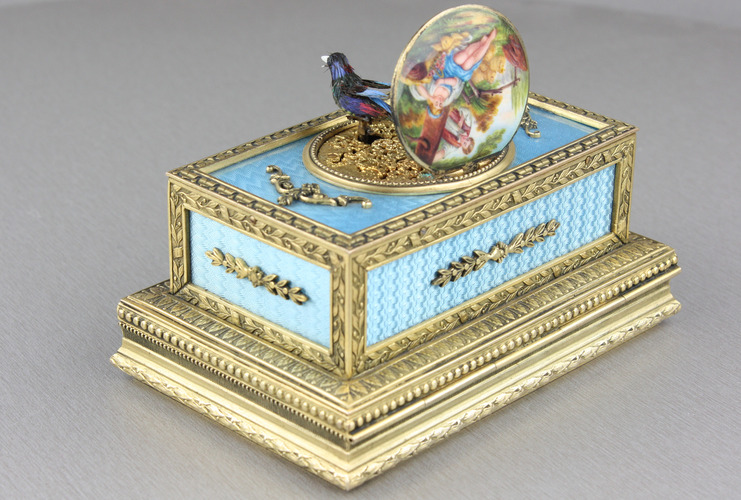 Powder blue guilloche and pictorial enamel singing bird box casket, by C. H. Marguerat